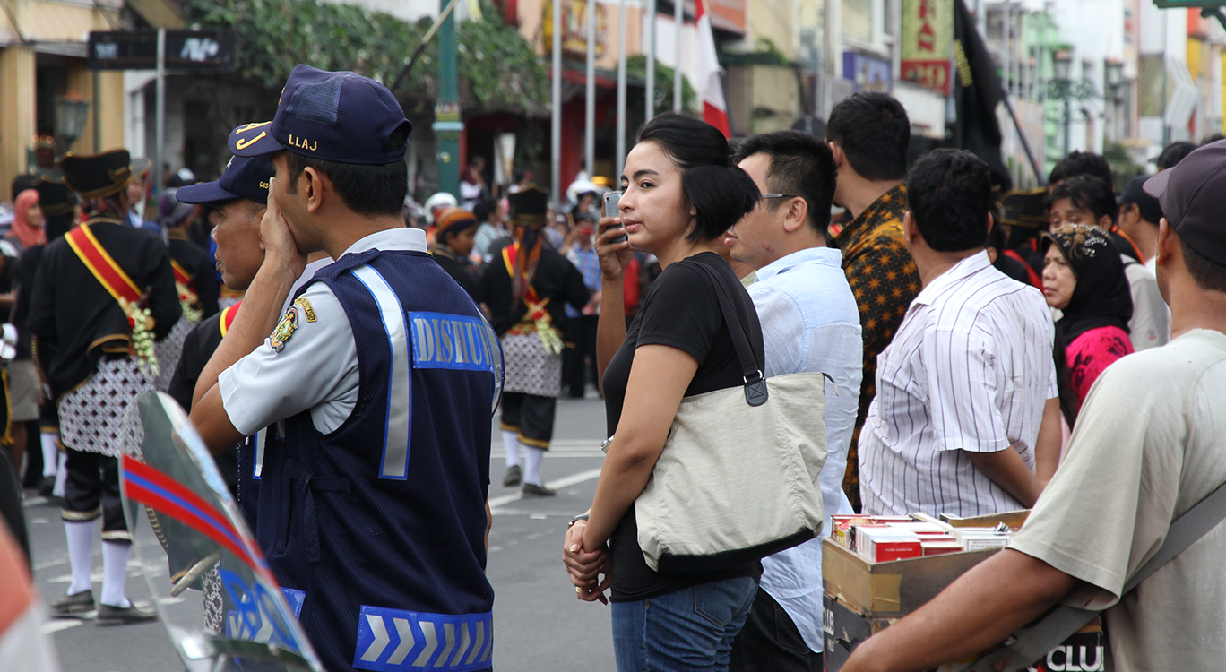 Group of people and officers during parade in Indonesia JUJUR BARENGAN festival